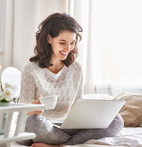 woman using HughesNet