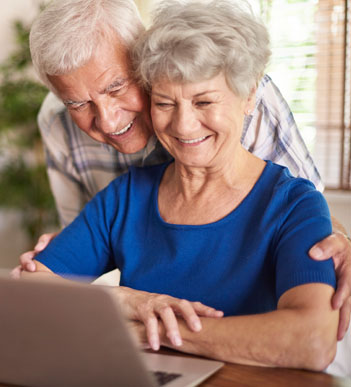Elderly couple using a laptop
